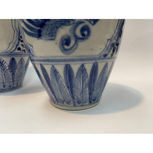 118 - A PAIR OF PAINTED PORCELAIN BLUE AND WHITE VASES, inverted bulbous form with narrow neck, decorated ... 