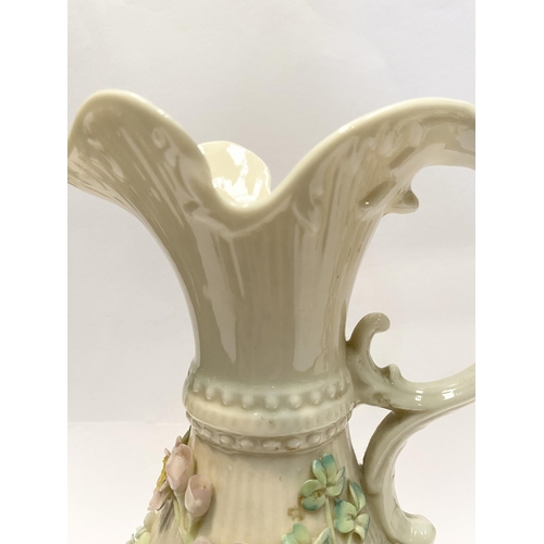 124 - A LARGE BELLEEK PORCELAIN ABERDEEN ROSE EWER, of baluster form with excellent applied roses with ban... 