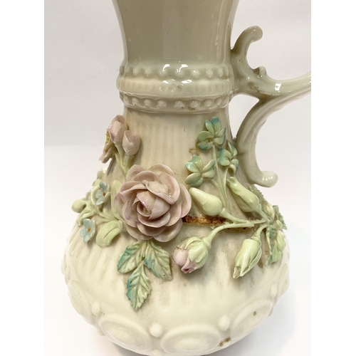 124 - A LARGE BELLEEK PORCELAIN ABERDEEN ROSE EWER, of baluster form with excellent applied roses with ban... 