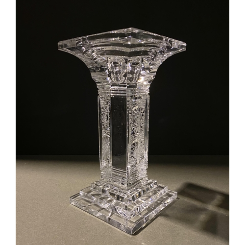 132 - AN ORIGINAL BOHEMIAN LEAD CRYSTAL CANDLESTICK, in the classic Paris cut, along with a vintage hardwo... 