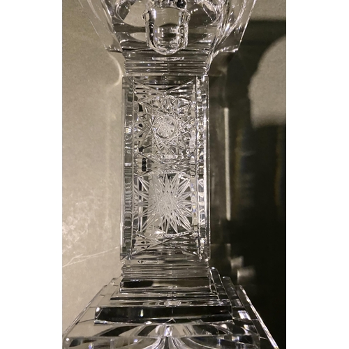 132 - AN ORIGINAL BOHEMIAN LEAD CRYSTAL CANDLESTICK, in the classic Paris cut, along with a vintage hardwo... 