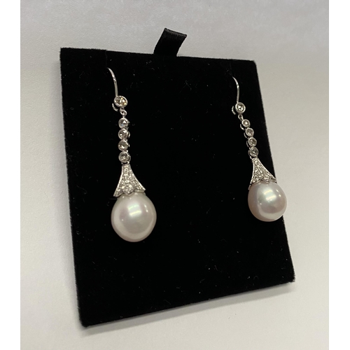 137 - A BEAUTIFUL PAIR OF 18CT WHITE GOLD SOUTH SEA PEARL AND DIAMOND DROP EARRINGS, with five round cut d... 