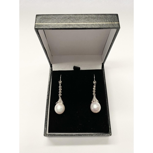 137 - A BEAUTIFUL PAIR OF 18CT WHITE GOLD SOUTH SEA PEARL AND DIAMOND DROP EARRINGS, with five round cut d... 