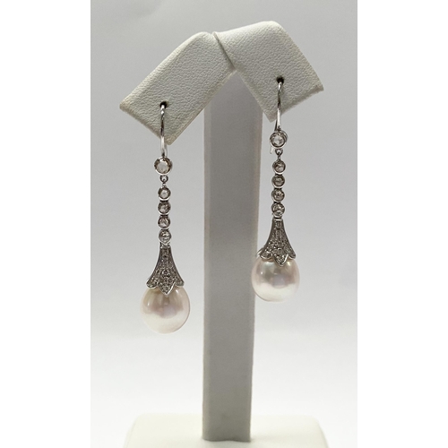 137 - A BEAUTIFUL PAIR OF 18CT WHITE GOLD SOUTH SEA PEARL AND DIAMOND DROP EARRINGS, with five round cut d... 