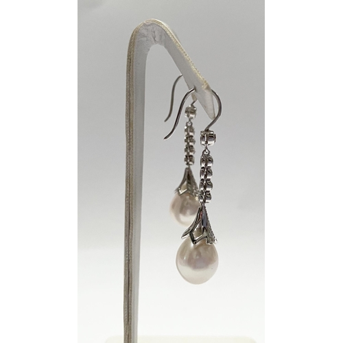 137 - A BEAUTIFUL PAIR OF 18CT WHITE GOLD SOUTH SEA PEARL AND DIAMOND DROP EARRINGS, with five round cut d... 