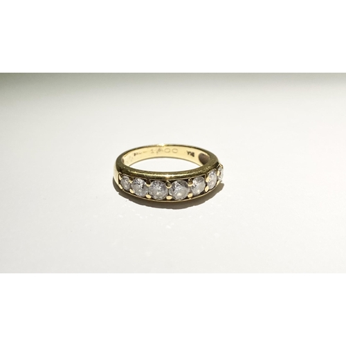 141 - A SPARKLING 18CT YELLOW GOLD SEVEN STONE DIAMOND BAND, with seven round cut diamonds in 18ct yellow ... 