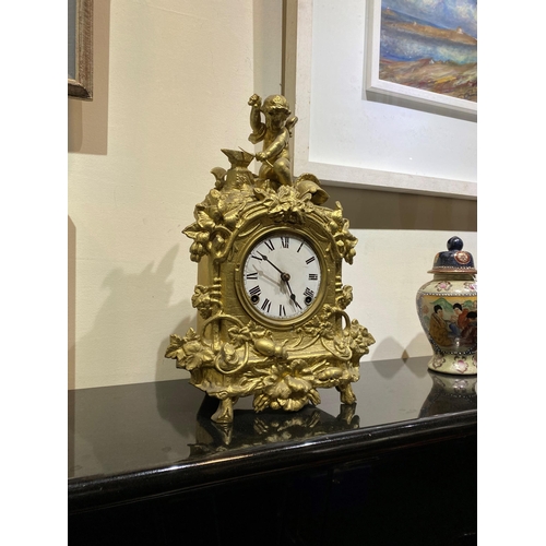 147 - A DECORATIVE VINTAGE FRENCH STYLE GILT MANTLE CLOCK, with roman numerals to dial within highly decor... 