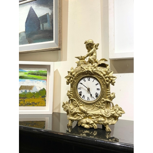 147 - A DECORATIVE VINTAGE FRENCH STYLE GILT MANTLE CLOCK, with roman numerals to dial within highly decor... 