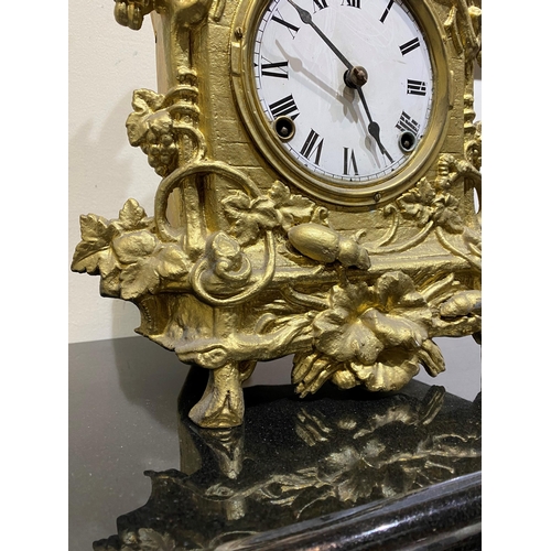 147 - A DECORATIVE VINTAGE FRENCH STYLE GILT MANTLE CLOCK, with roman numerals to dial within highly decor... 