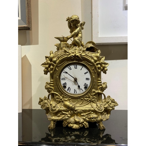 147 - A DECORATIVE VINTAGE FRENCH STYLE GILT MANTLE CLOCK, with roman numerals to dial within highly decor... 