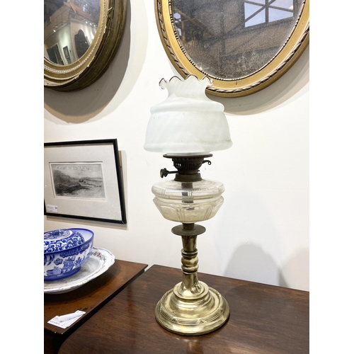 151 - A BEAUTIFUL VICTORIAN OIL LAMP, the opaque white glass shade with ruffled rim, with double burner an... 