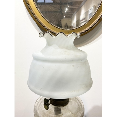 151 - A BEAUTIFUL VICTORIAN OIL LAMP, the opaque white glass shade with ruffled rim, with double burner an... 