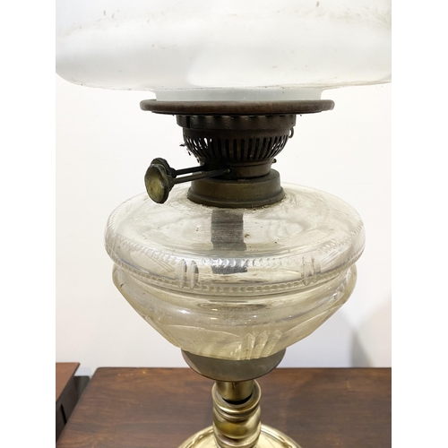 151 - A BEAUTIFUL VICTORIAN OIL LAMP, the opaque white glass shade with ruffled rim, with double burner an... 