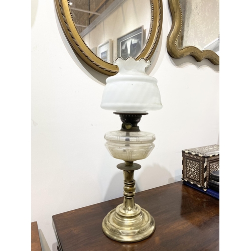 151 - A BEAUTIFUL VICTORIAN OIL LAMP, the opaque white glass shade with ruffled rim, with double burner an... 