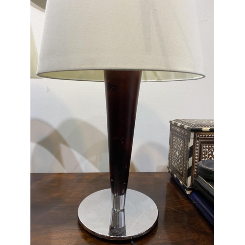 152 - A PAIR OF CHROME AND ROSEWOOD STYLE TABLE LAMPS, with tapered support atop circular base. Dimensions... 