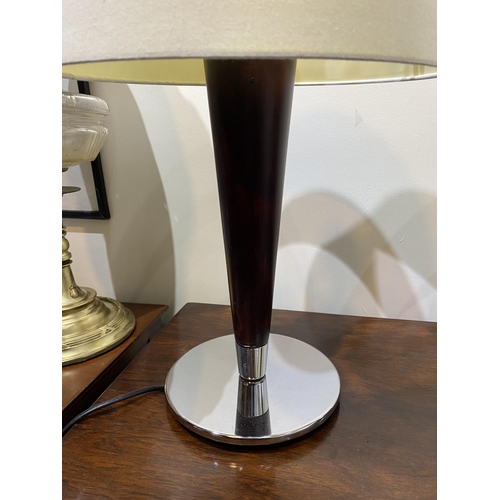 152 - A PAIR OF CHROME AND ROSEWOOD STYLE TABLE LAMPS, with tapered support atop circular base. Dimensions... 