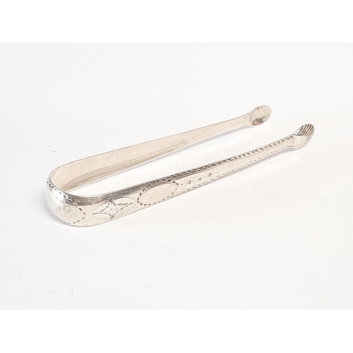 156 - AN 18TH CENTURY SILVER SUGAR TONGS, by the maker John Dalrymple. Circa 1790. Decorated all over with... 