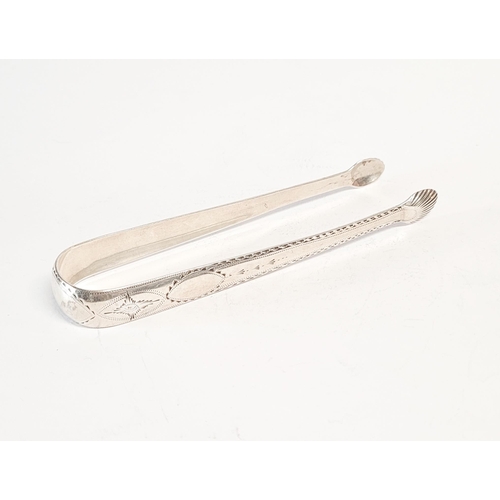 156 - AN 18TH CENTURY SILVER SUGAR TONGS, by the maker John Dalrymple. Circa 1790. Decorated all over with... 