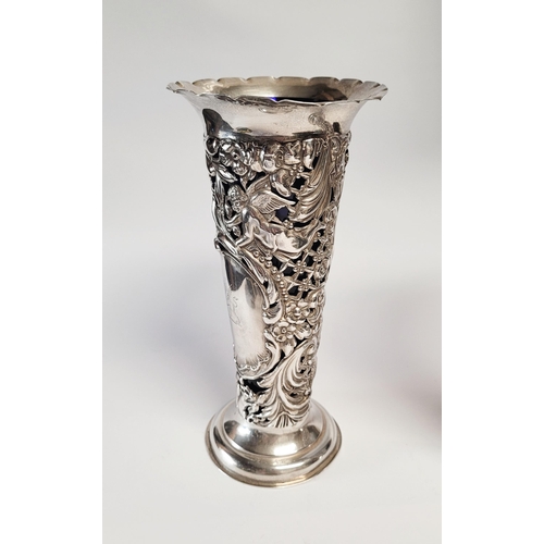 157 - A LATE 19TH CENTURY PAIR OF SILVER BUD VASES, with purple glass liners, each vase decorated all over... 