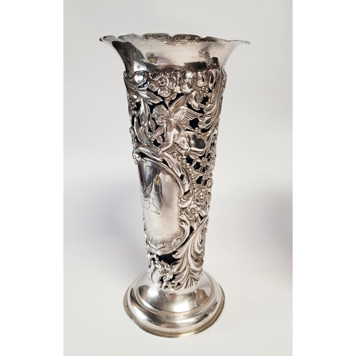 157 - A LATE 19TH CENTURY PAIR OF SILVER BUD VASES, with purple glass liners, each vase decorated all over... 