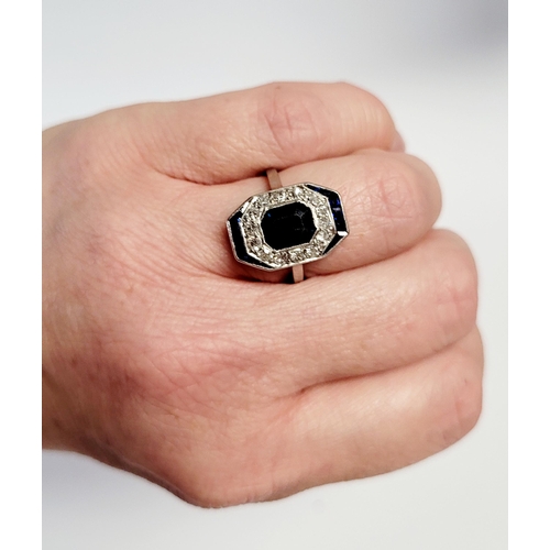 158 - A FRENCH ART DECO SAPPHIRE & DIAMOND CLUSTER RING, with a central dark sapphire surrounded by a fram... 