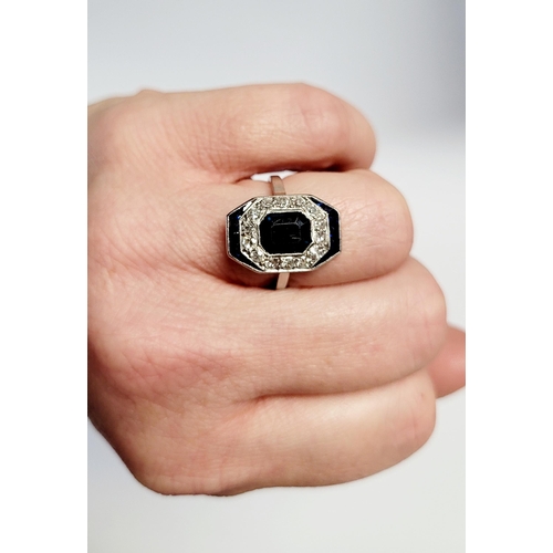 158 - A FRENCH ART DECO SAPPHIRE & DIAMOND CLUSTER RING, with a central dark sapphire surrounded by a fram... 