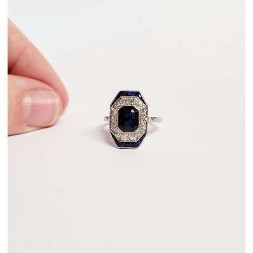 158 - A FRENCH ART DECO SAPPHIRE & DIAMOND CLUSTER RING, with a central dark sapphire surrounded by a fram... 