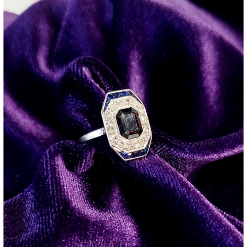 158 - A FRENCH ART DECO SAPPHIRE & DIAMOND CLUSTER RING, with a central dark sapphire surrounded by a fram... 