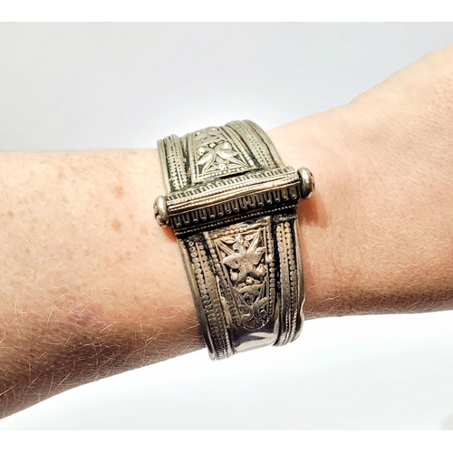 164 - A PAIR OF AFGHAN SILVER BANGLES, each decorated with beautiful bird & foliage decoration, the bangle... 