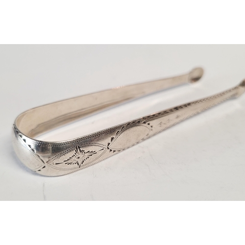 169 - AN IRISH 18TH CENTURY SILVER SUGAR TONGS, by the maker Benjamin Taitt. Circa 1790. Decorated with a ... 