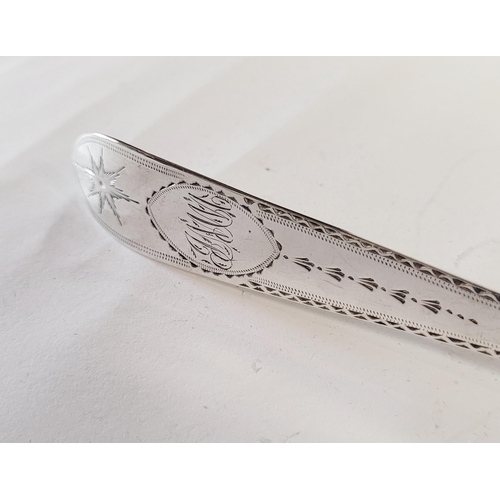 174 - A LARGE IRISH TURN OF 19TH CENTURY SILVER BASTING SPOON, the handle & tip decorated with bright cut ... 