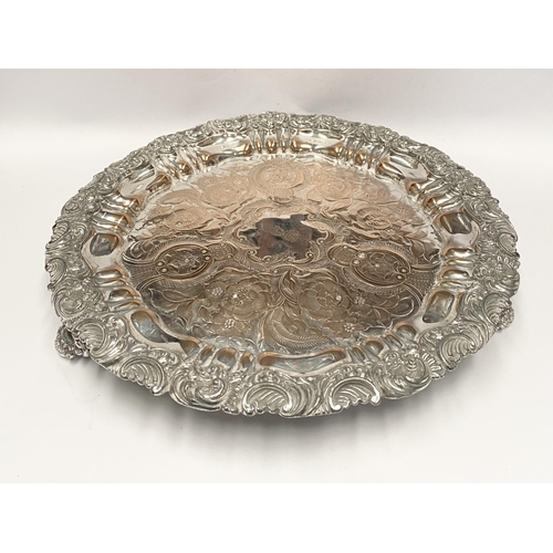 181 - A VERY DECORATIVE SILVER PLATED LARGE SALVER, with engraved cartouche to centre surrounded by engrav... 