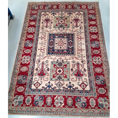 189 - AN EXCELLENT HAND-KNOTTED KAZAK RUG, hand-woven, featuring tradition Kazak pattern with multiple geo... 