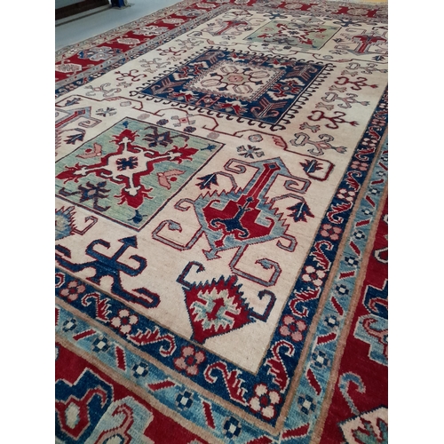 189 - AN EXCELLENT HAND-KNOTTED KAZAK RUG, hand-woven, featuring tradition Kazak pattern with multiple geo... 