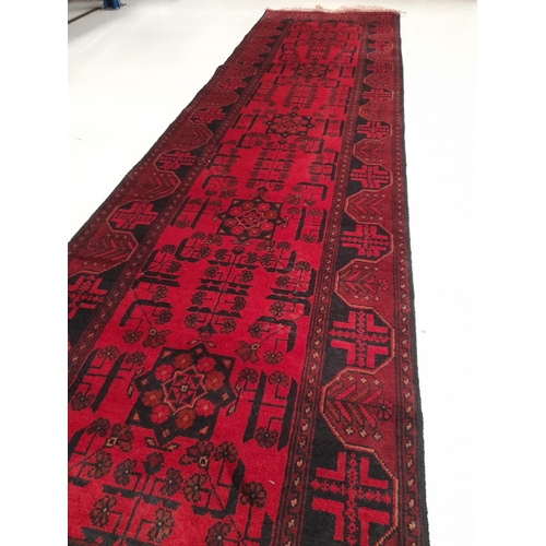 201 - A VIBRANT AFGHAN KHAN MOHAMMADI RUNNER RUG, hand-woven in the traditional Khan Mohammadi pattern in ... 