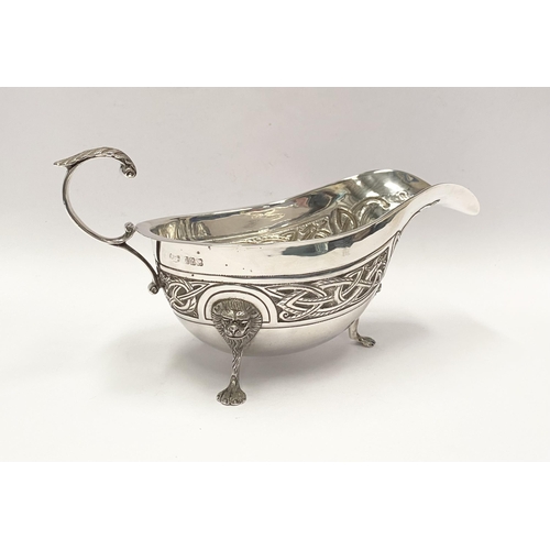 21 - A LARGE IRISH SILVER SAUCE BOAT, Hallmarked H&H (likely Hopkins & Hopkins) Dublin c.1935. Decorated ... 