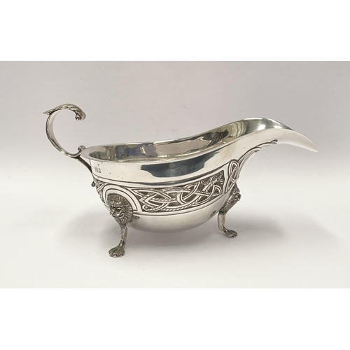 21 - A LARGE IRISH SILVER SAUCE BOAT, Hallmarked H&H (likely Hopkins & Hopkins) Dublin c.1935. Decorated ... 