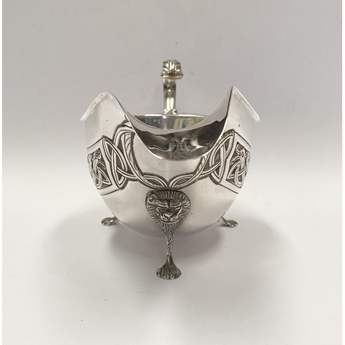 21 - A LARGE IRISH SILVER SAUCE BOAT, Hallmarked H&H (likely Hopkins & Hopkins) Dublin c.1935. Decorated ... 