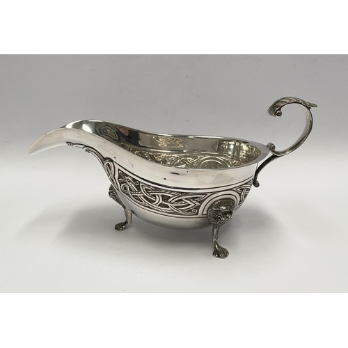 21 - A LARGE IRISH SILVER SAUCE BOAT, Hallmarked H&H (likely Hopkins & Hopkins) Dublin c.1935. Decorated ... 