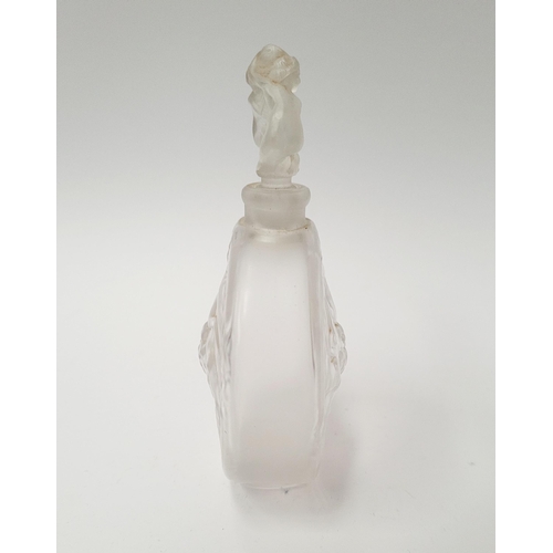 215 - A MID-CENTURY FROSTED PERFUME BOTTLE WITH RAISED RELIEF DESIGN SHOWING INTERTWINED FIGURES, with sto... 