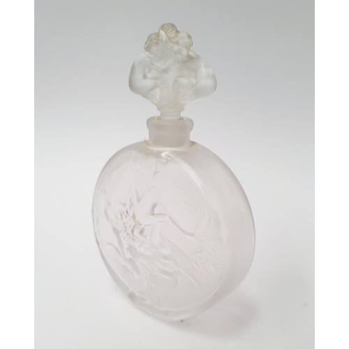 215 - A MID-CENTURY FROSTED PERFUME BOTTLE WITH RAISED RELIEF DESIGN SHOWING INTERTWINED FIGURES, with sto... 