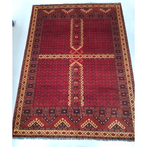 219 - AN EXCELLENT AFGHAN KHARGHAR RUG, hand-woven in the traditional pattern in vibrant red and navy. Dim... 