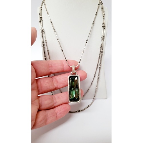 220 - A BEAUTIFUL UNO DE 50 AURORA BOREALIS SET; comprising of a pendant necklace, a pair of earrings & a ... 