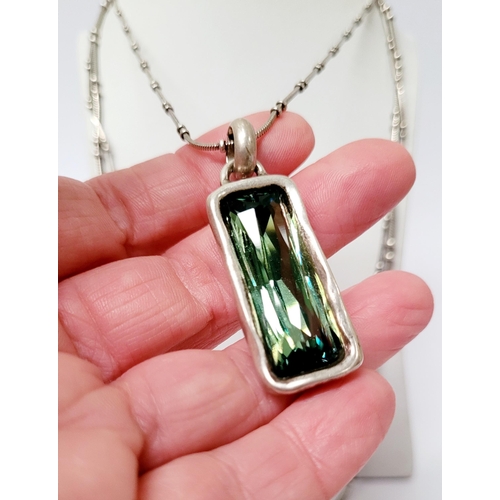 220 - A BEAUTIFUL UNO DE 50 AURORA BOREALIS SET; comprising of a pendant necklace, a pair of earrings & a ... 