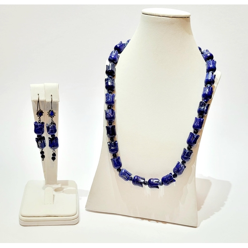 221 - A UNIQUE & BEAUTIFUL HAND CARVED LAPIS NECKLACE & EARRING SET, necklace comprising of individual car... 