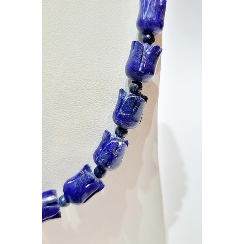 221 - A UNIQUE & BEAUTIFUL HAND CARVED LAPIS NECKLACE & EARRING SET, necklace comprising of individual car... 