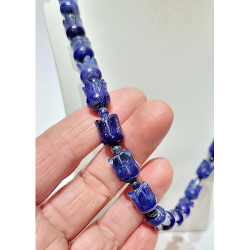 221 - A UNIQUE & BEAUTIFUL HAND CARVED LAPIS NECKLACE & EARRING SET, necklace comprising of individual car... 