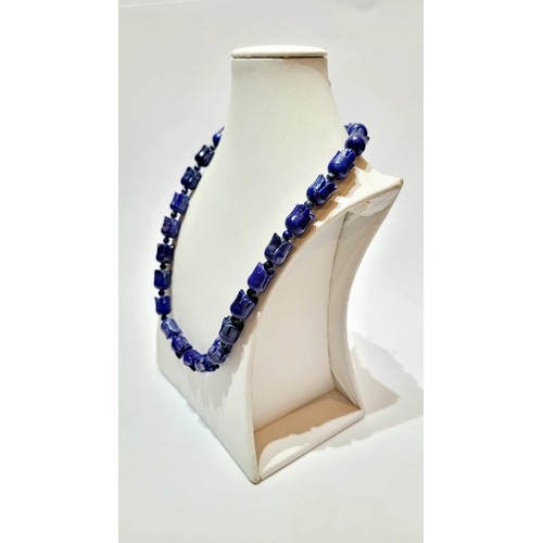 221 - A UNIQUE & BEAUTIFUL HAND CARVED LAPIS NECKLACE & EARRING SET, necklace comprising of individual car... 