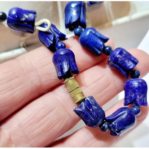 221 - A UNIQUE & BEAUTIFUL HAND CARVED LAPIS NECKLACE & EARRING SET, necklace comprising of individual car... 