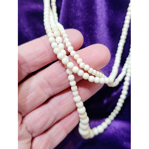 226 - A SET OF THREE BONE BEAD NECKLACES, (i) 44.5cm long open, (ii) & (iii) 37.5cm long open.